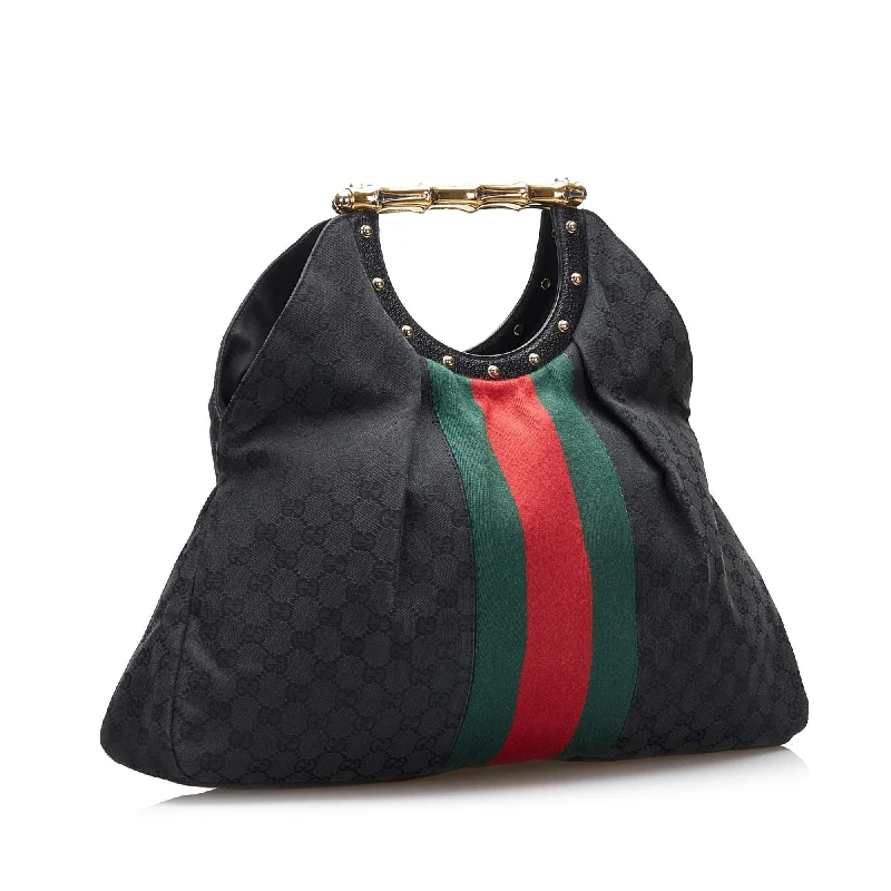 Women Gucci tote bags in GG Supreme canvas for a branded feelGucci GG Canvas Web Metal Bamboo Tote (SHG-XlBfM7)