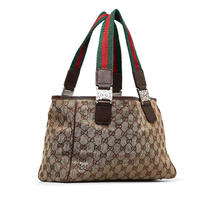 Women Gucci bags with a snap - button closure and a decorative charmGucci GG Canvas Web Pop Tote (SHG-Jsskew)